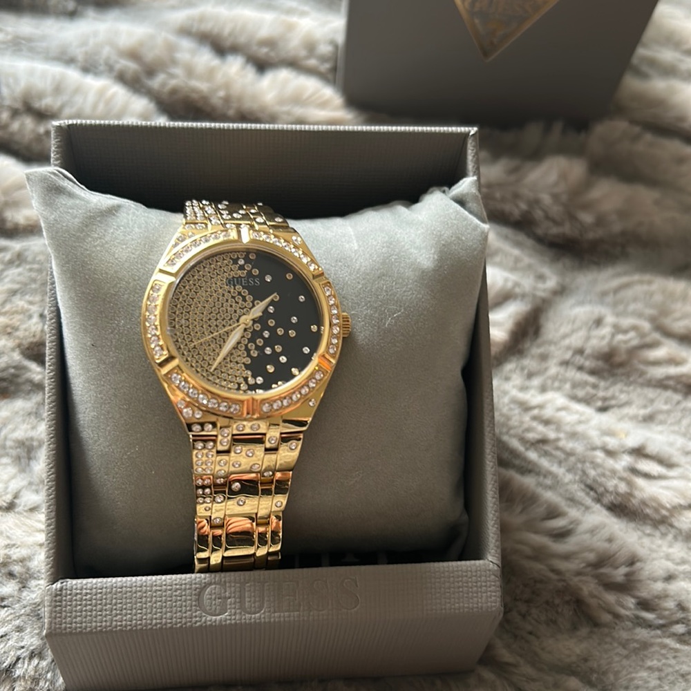 Brand new, only worn once, black and gold Guess watch for women